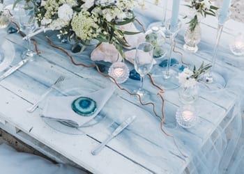 Ocean-themed wedding reception table at a beach-themed wedding