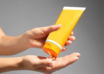Squeezing sunscreen out of a tube