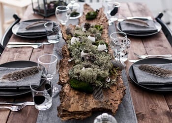 A rustic-themed wedding reception table setting