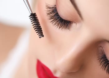 Perfectly Beautiful Use Waterproof Products Waterproof mascara being applied by a bride