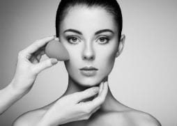 Makeup being applied to ladies face 