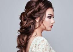 brides hair back with loose curls 