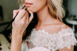 Hair and Makeup Wedding day Lipstick applied to bride