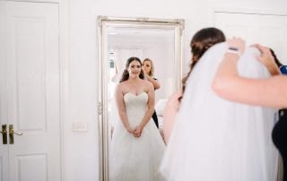 Sarah applying a wedding veil